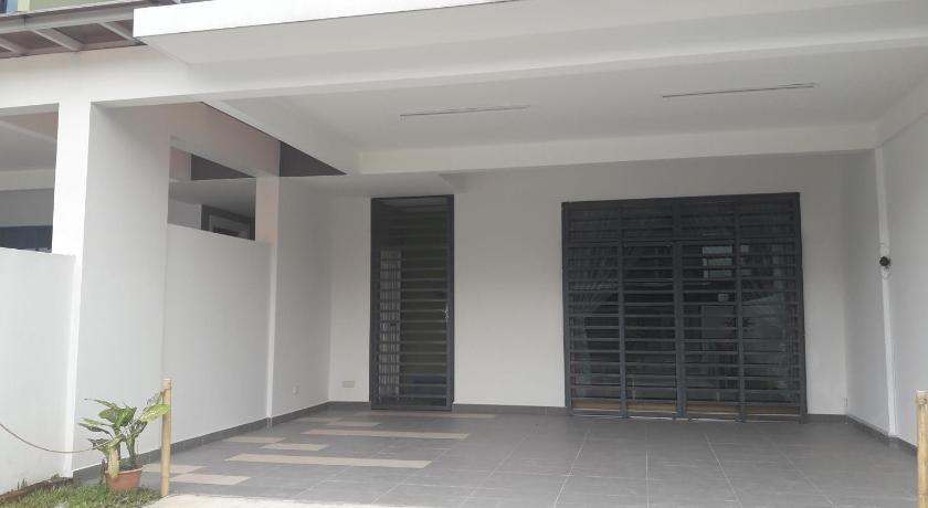 a large white building with a door open, Tampoi Homestay in Johor Bahru