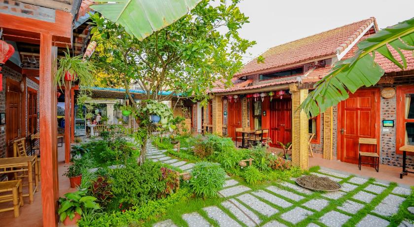 a garden area with trees and a building, Tam Coc Moonlight Bungalow in Ninh Bình