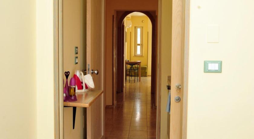 a room with a door leading to a hallway, Cala Dei Normanni - Camere sulle Mura in Otranto