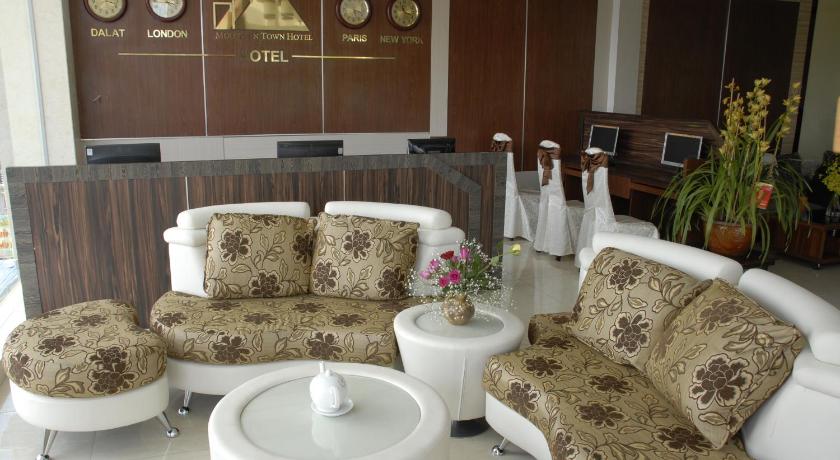 a living room with two couches and a coffee table, Pho Nui Hotel in Dalat