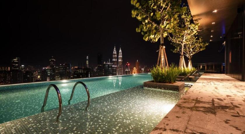 a pool of water with a fountain in the middle of it, Expressionz Suites By iHost Global in Kuala Lumpur