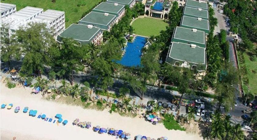 a beach with a lot of lawn chairs and umbrellas, Phuket Graceland Resort & Spa (SHA Plus+) in Phuket