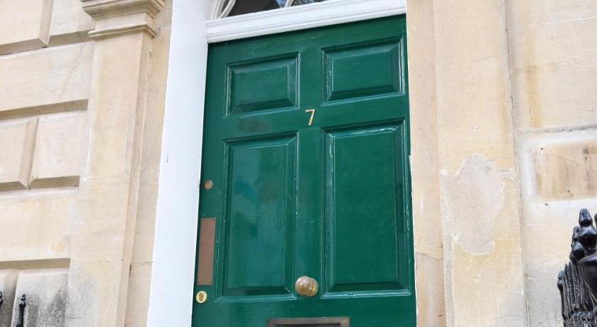 a blue door leading to a large room with a blue door, Berkeley Sq Pads - Your Apartment in Bristol