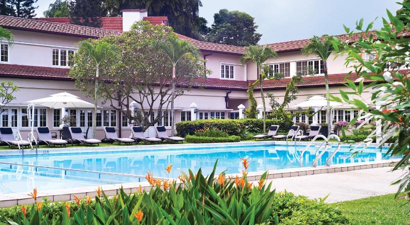 a house with a pool and lawn chairs, Goodwood Park Hotel (SG Clean Certified) in Singapore
