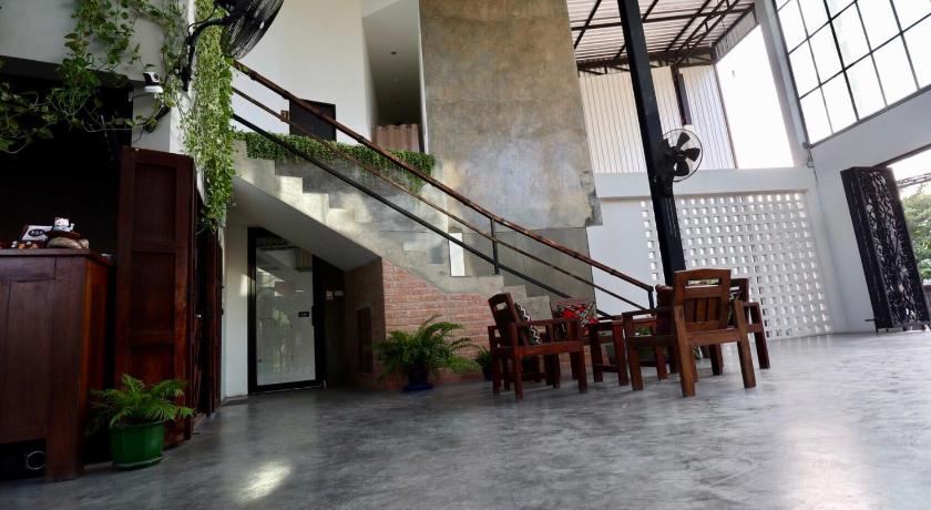 a large room with tables and chairs in it, Nornlamphun Boutique Hotel in Lamphun