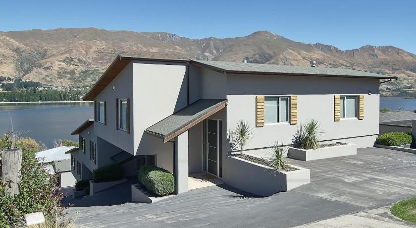 a house with a view of a lake and mountains, Lakeview Heights Luxury Apartment 2 in Wanaka