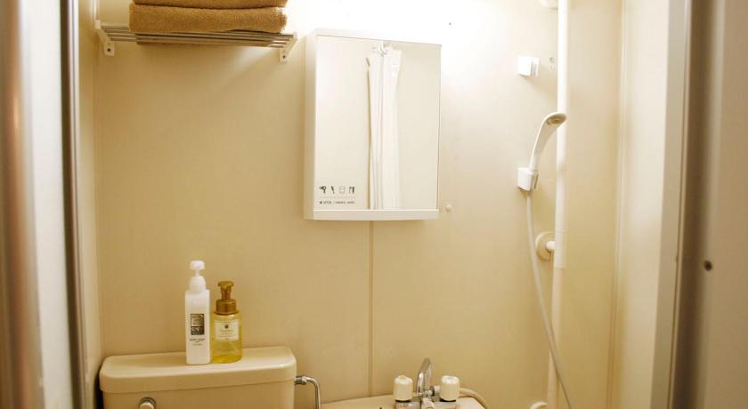a bathroom with a sink, toilet and shower stall, Hotel Chocolat (Adult Only) in Tokyo