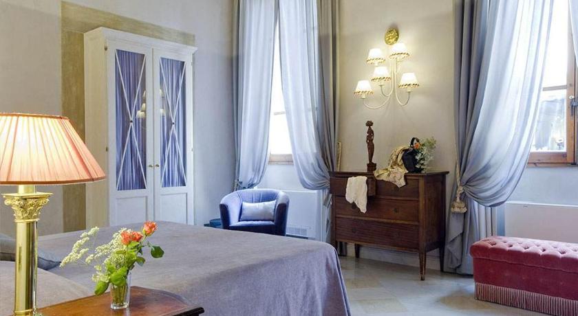 a hotel room with a bed, table, lamp and window, Residenza Castiglioni in Florence