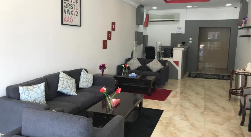 a living room filled with furniture and a couch, Blue Sands Al Bilsan Furnished Units in Dammam
