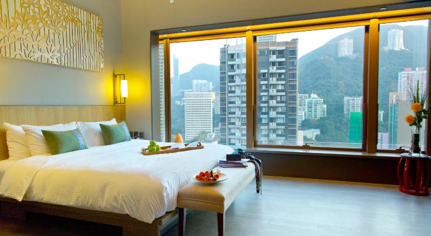 a hotel room with two beds and a window, Wanchai 88 Hotel in Hong Kong