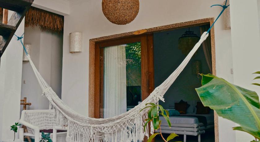 a white umbrella hanging from the ceiling of a house, My Gili Paradise in Lombok