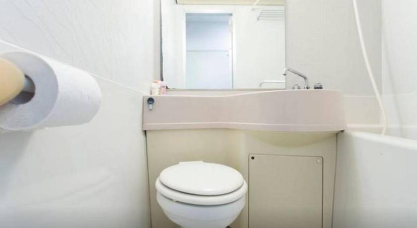 a white toilet sitting next to a white sink, Yakuendai Wacore Elegance in Funabashi