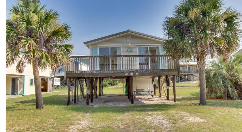 a large white house with trees, First Avenue Fantasy in Gulf Shores (AL)
