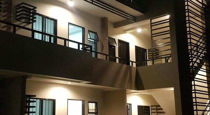 a hotel room with a balcony and a stairwell, Mailz Haven 2BR Apartment in Davao City