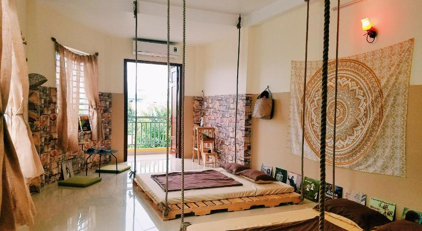 a bedroom with a large window and a large bed, BAP.Homestay in Ho Chi Minh City