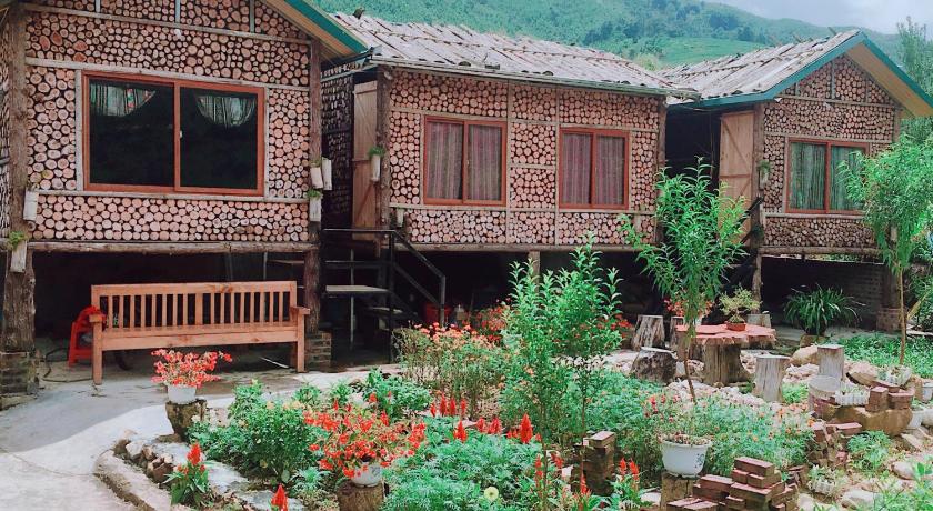 a house with a wooden roof and a bench in front of it, Ta Van Heaven Homestay in Sapa