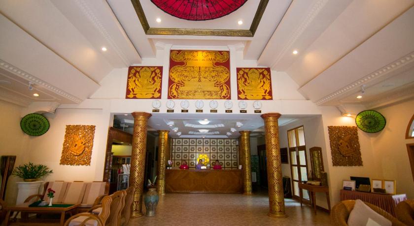 a large room with a large clock on the ceiling, Bagan Umbra Hotel in Bagan