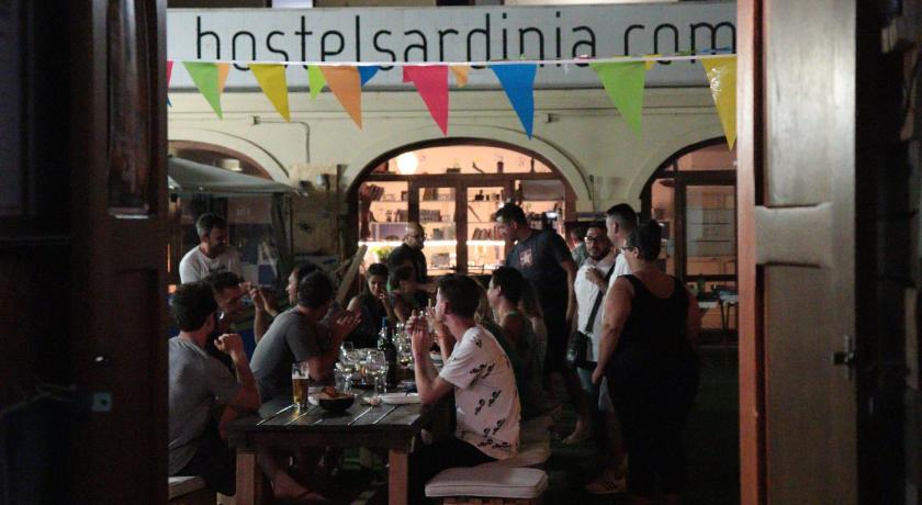 people sitting at a table in a restaurant, Hostel Sardinia in Quartu Sant Elena