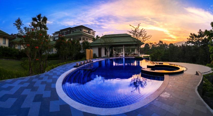 a swimming pool with a pool table and chairs, Vivace Khaoyai Resort in Khao Yai