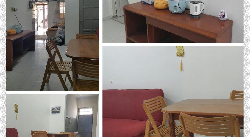 a living room filled with furniture and a table, DIDIE HOMESTAY 1 in Tanah Merah