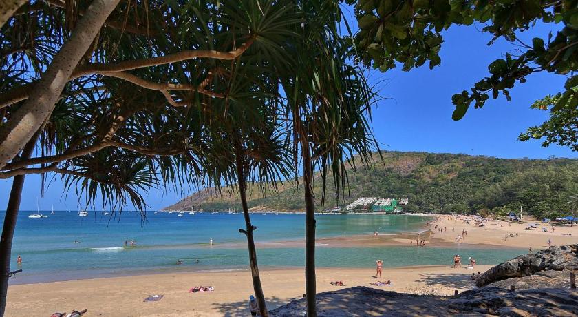 a beach with palm trees and palm trees, Mangosteen Ayurveda & Wellness Resort (SHA Plus+) in Phuket