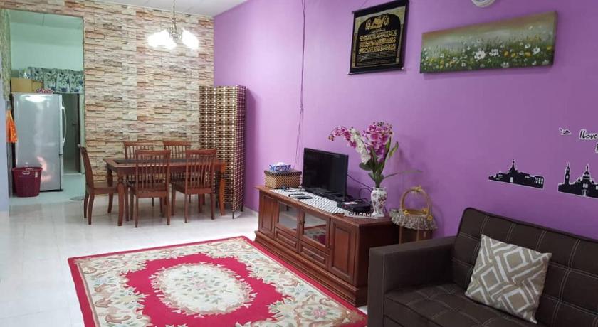 a living room filled with furniture and a tv, Homestay De MITC Melaka in Malacca