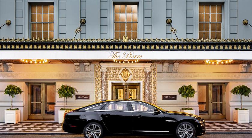 a car that is parked in front of a building, The Pierre A Taj Hotel in New York (NY)