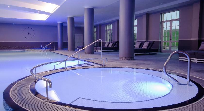 a large swimming pool with a large mirror in the middle of it, Fairmont St Andrews - Scotland in St. Andrews