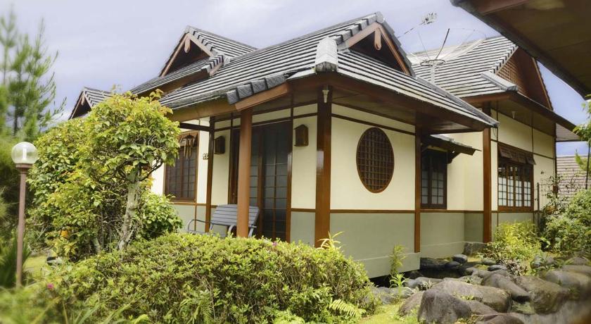 a large house with a large window, Villa Kota Bunga Ade Type Jepang - 0224 in Puncak