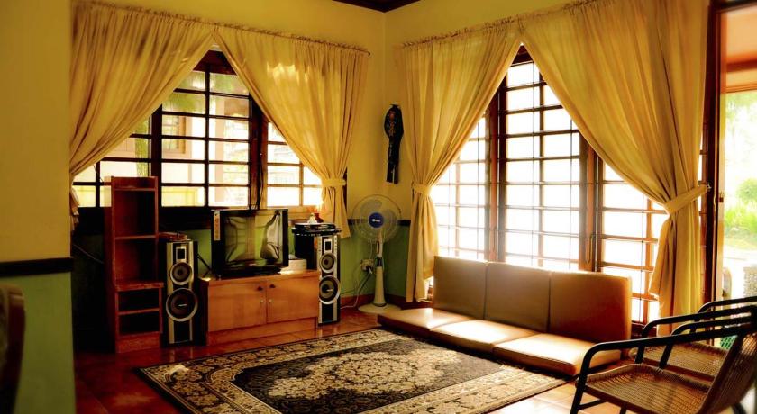 a living room filled with furniture and a window, Villa Kota Bunga Ade Type Jepang - 0608 in Puncak