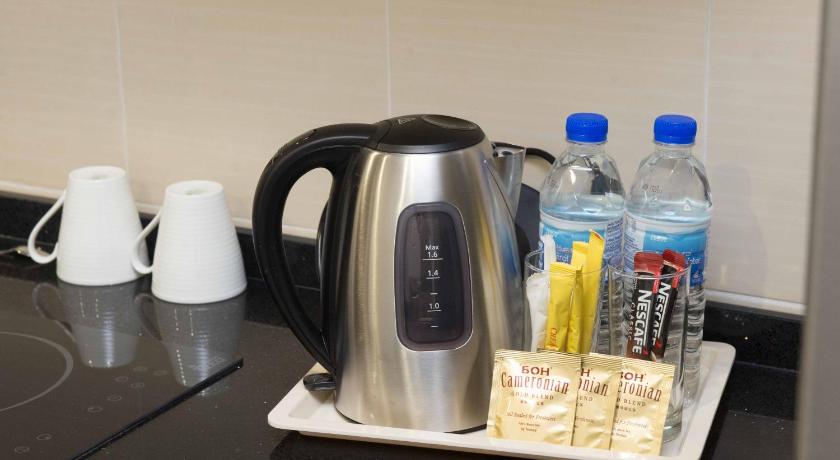 a blender sitting on top of a counter next to a cup of coffee, Encorp Marina Suites by Iconic Bliss in Johor Bahru