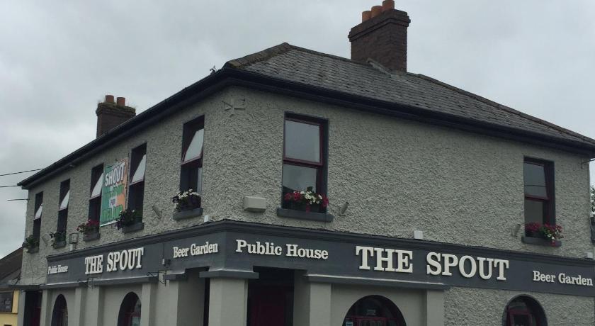 a brick building with a sign on the side of it, The Rooms at The Spout in Kilcullen