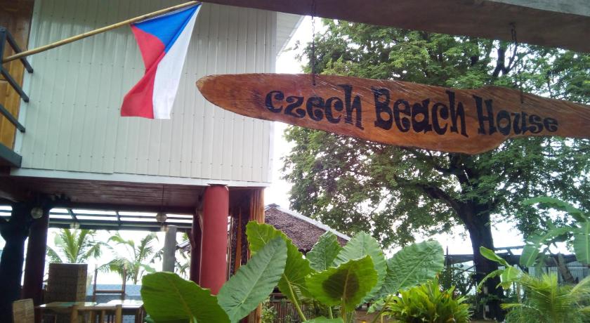 a sign that is hanging on a pole in front of a building, Czech Beach House Adults Only in Guimaras Island