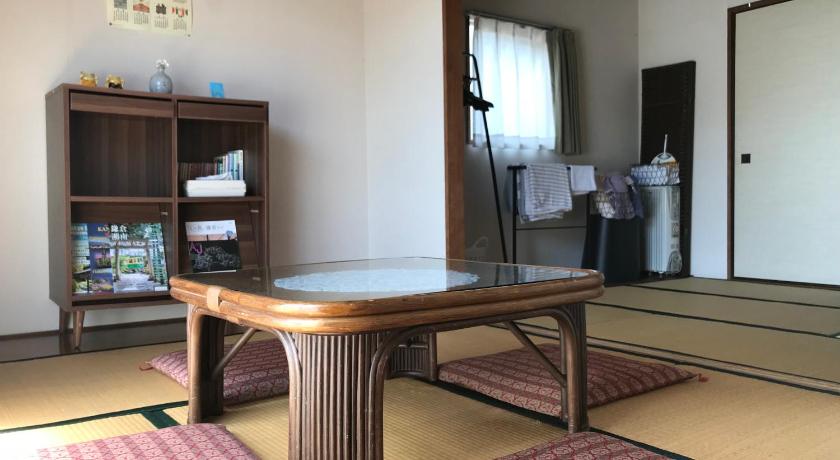 a living room with a table and chairs, Yuigahama Apart in Kamakura