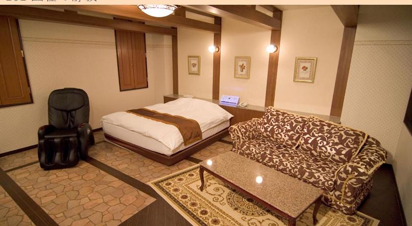a hotel room with a bed, desk, and nightstand, Hotel Very Matsusaka (Adult Only) in Tsu