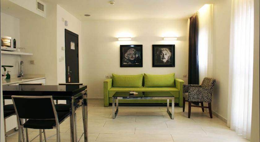 a living room with a couch and a table, Best Western Regency Suites in Tel Aviv