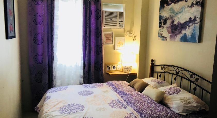 a bedroom with a bed and a window, Mailz Haven #6 2BR Cozy Apartment 750m Near SM in Davao City