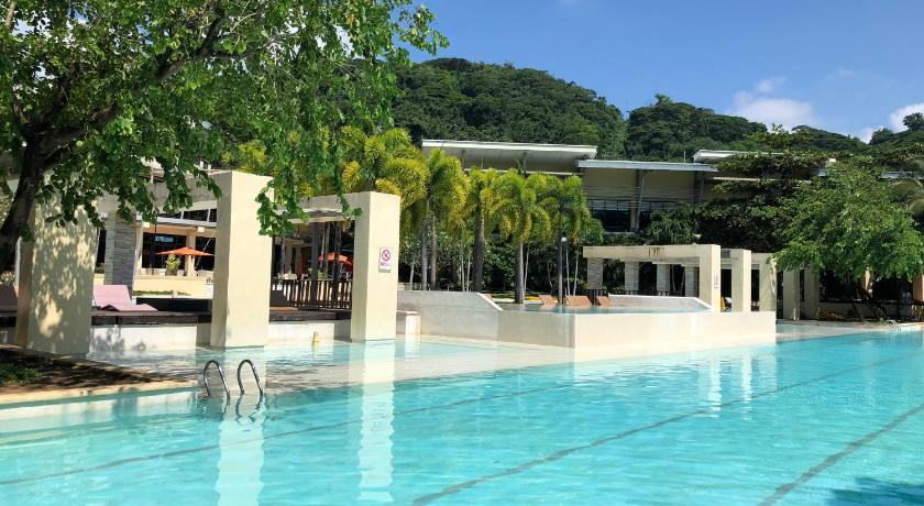 a swimming pool with a large swimming pool, Pico de Loro 2BR Vacation Flat in Nasugbu