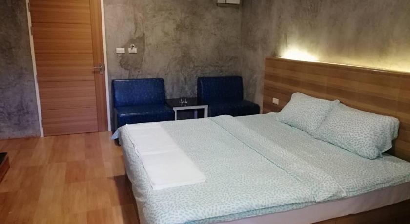 a bedroom with a bed and a desk, Sands Place Apartment and Hotel in Samut Sakhon