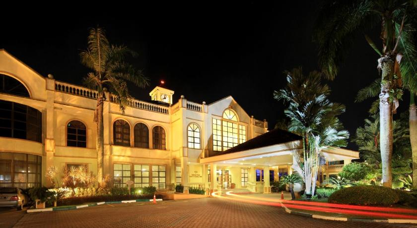a large building with a clock on the front of it, Tanjong Puteri Golf Resort in Johor Bahru