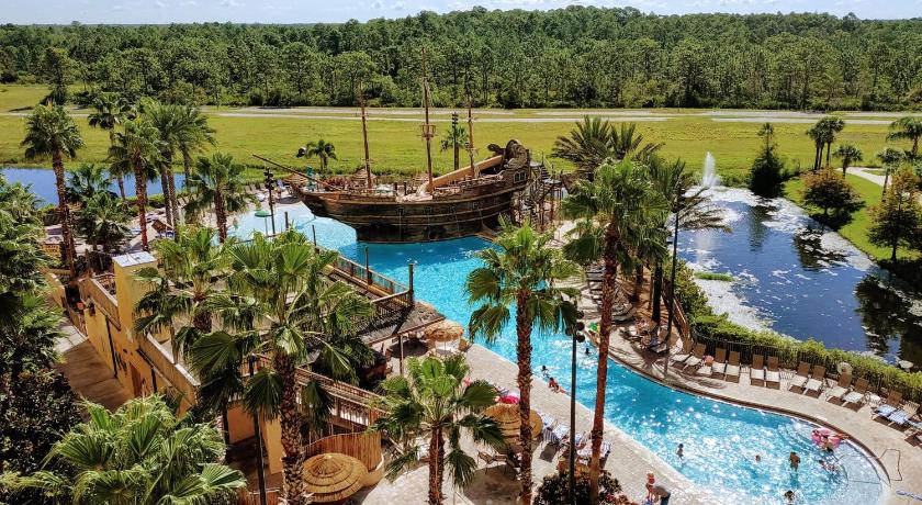 a beach with palm trees and palm trees, Lake Buena Vista Resort Village & Spa in Orlando (FL)