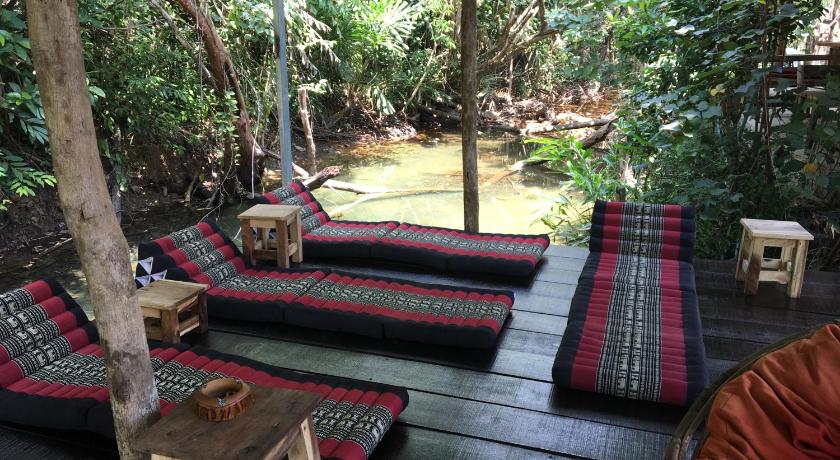 a living room with two couches and a table, Freedom home in Koh Chang