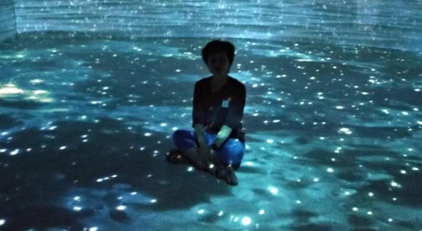 a boy in the water with a boogie board, Jinsha Cultural Village in Matsu Island