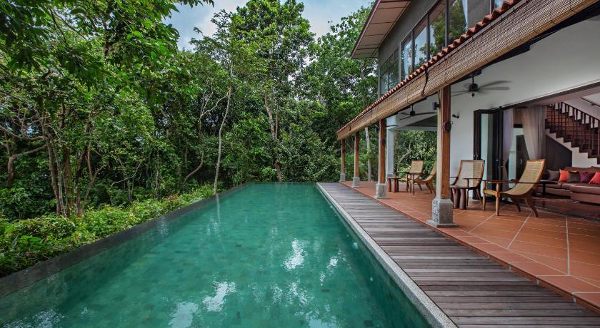 a swimming pool with a balcony overlooking the water, Ambong Pool Villas - Private Pool in Langkawi