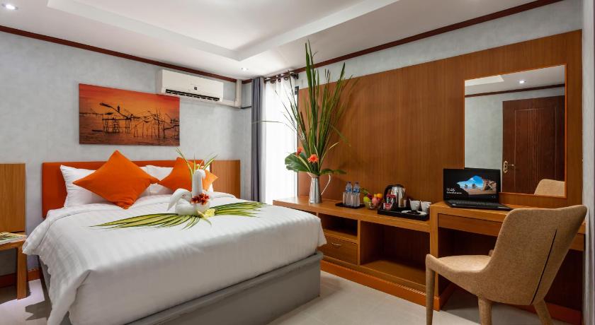 a bedroom with a large bed and a large window, The Iconic Hotel Suvarnbhumi Airport in Samut Prakan