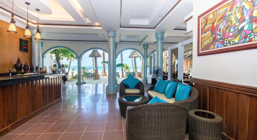 a large room with a lot of chairs and a large window, Royal Park Hotel in Boracay Island