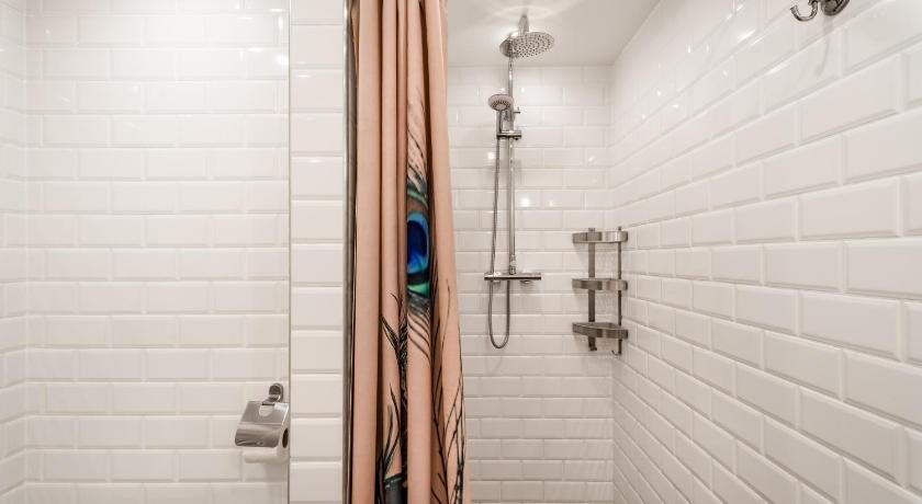 a bathroom with a shower stall and a walk in shower, Hello Downtown Apartment - Boulevard in Budapest