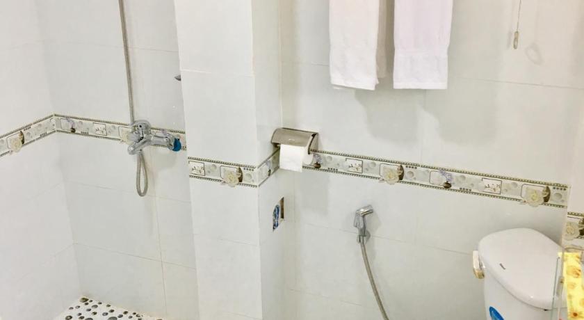 a bathroom with a sink, toilet and shower stall, Baoanh Hostel in Ho Chi Minh City