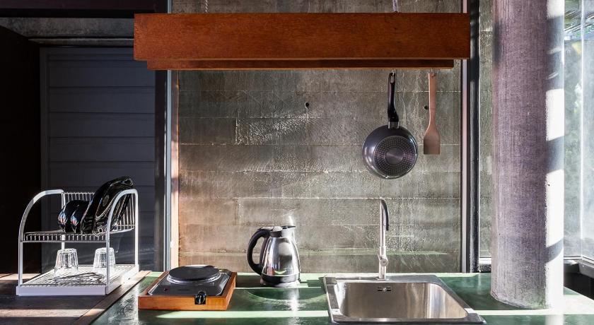 a kitchen counter with a sink and a dishwasher, Co-Co Nut and Noom Resort in Ko Pha-ngan