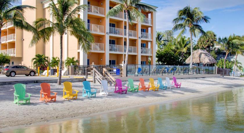 a beach filled with lots of colorful umbrellas, Hutchinson Island Plaza Hotel & Suites in Fort Pierce (FL)